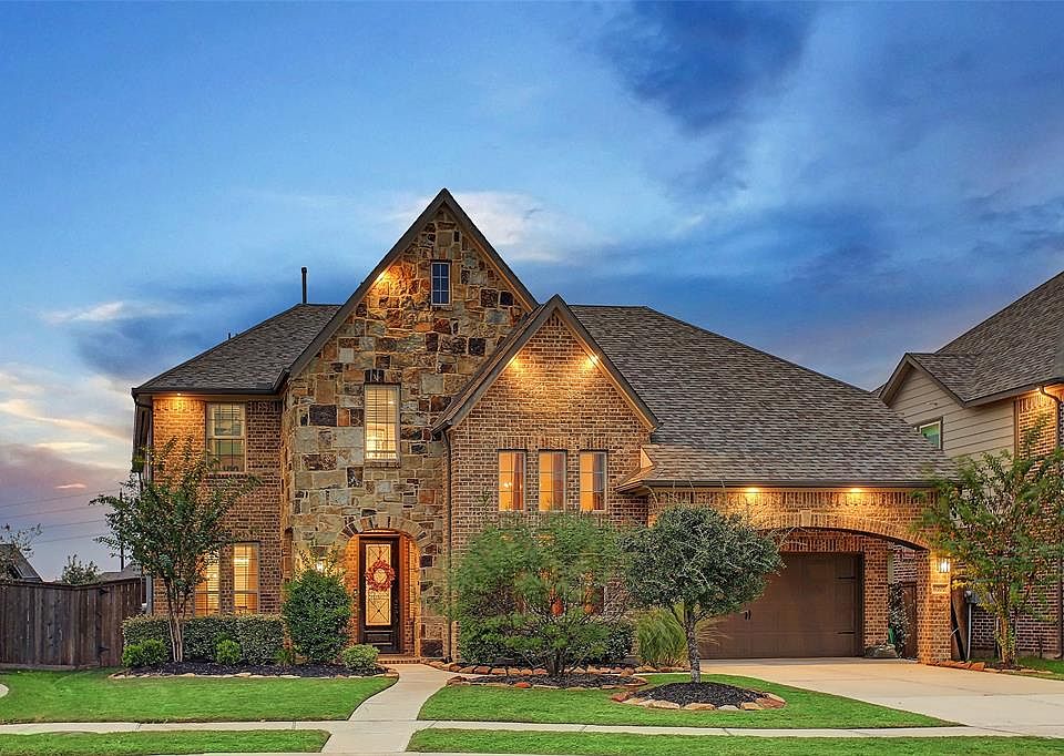 Stunning brick & stone clad home wonderfully crafted by Westin Homes.