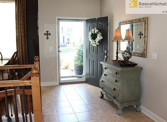 Beautiful tiled floor in foyer welcomes guests.