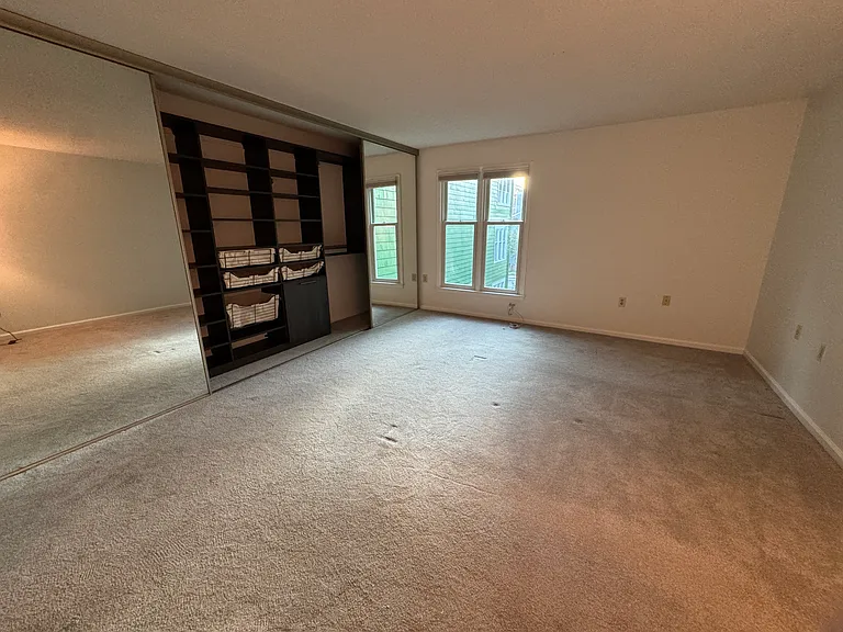 Master Bedroom includes floor to ceiling glass mirror doors with custom California Closet