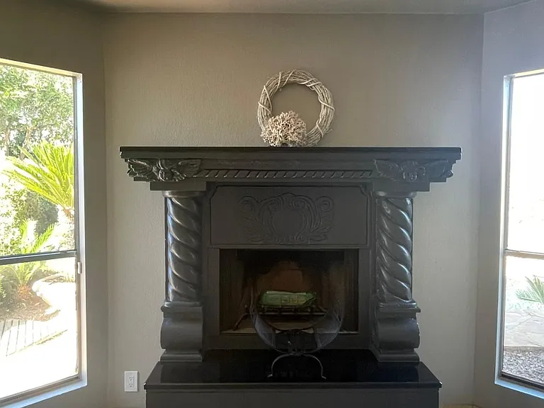 UNFURNISHED. Room for large smart TV over fireplace.