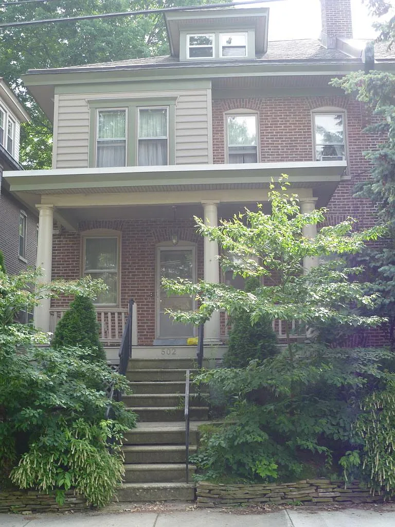 Exterior and front porch. Landscaped with native plants