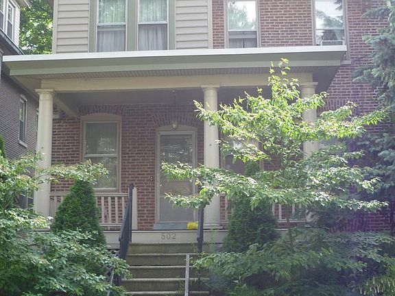 Exterior and front porch. Landscaped with native plants