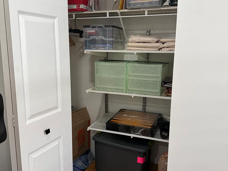 hallway closet between second bedroom and bathroom at the end of hallway