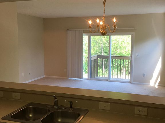 Kitchen overlooking living room, and balcony 