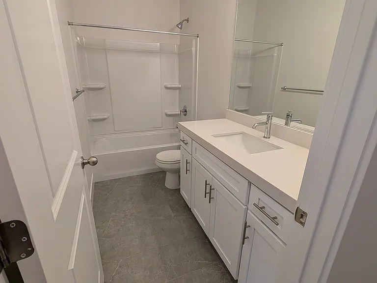 Main bath. Built in tub and great space.