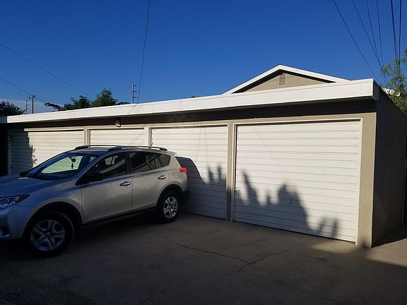 Alley entrance to parking garage behind Apartment building, 