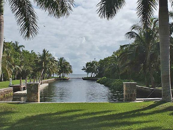 Private boat basin with docks, boat lift, new seawall. Direct access to bay