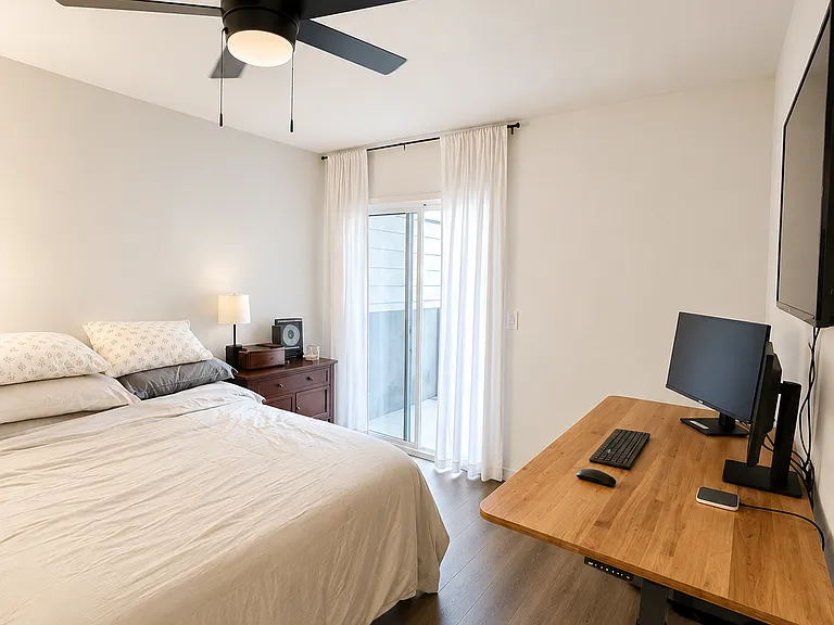 Primary bedroom. - Sliding door to outside area.