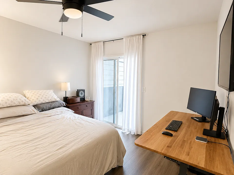 Primary bedroom. - Sliding door to outside area.