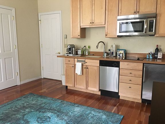 Kitchen, Main Closet on left, doorway to included private hall with 2nd and 3rd closets and washer/dryer.