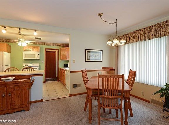 Vertical blinds and window treatments throughout!