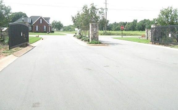 Professionally Landscaped Gated Entrance