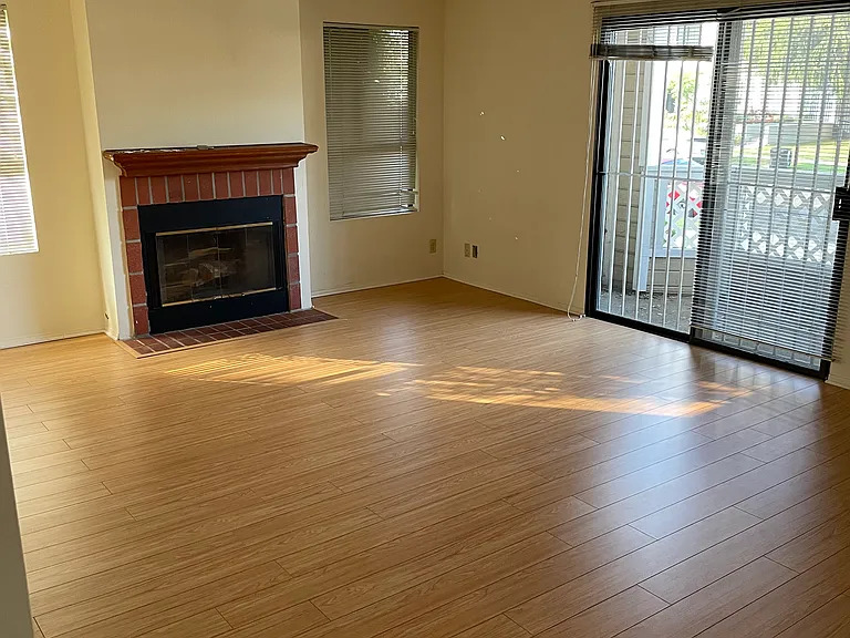 Living Room with fireplace and balcony