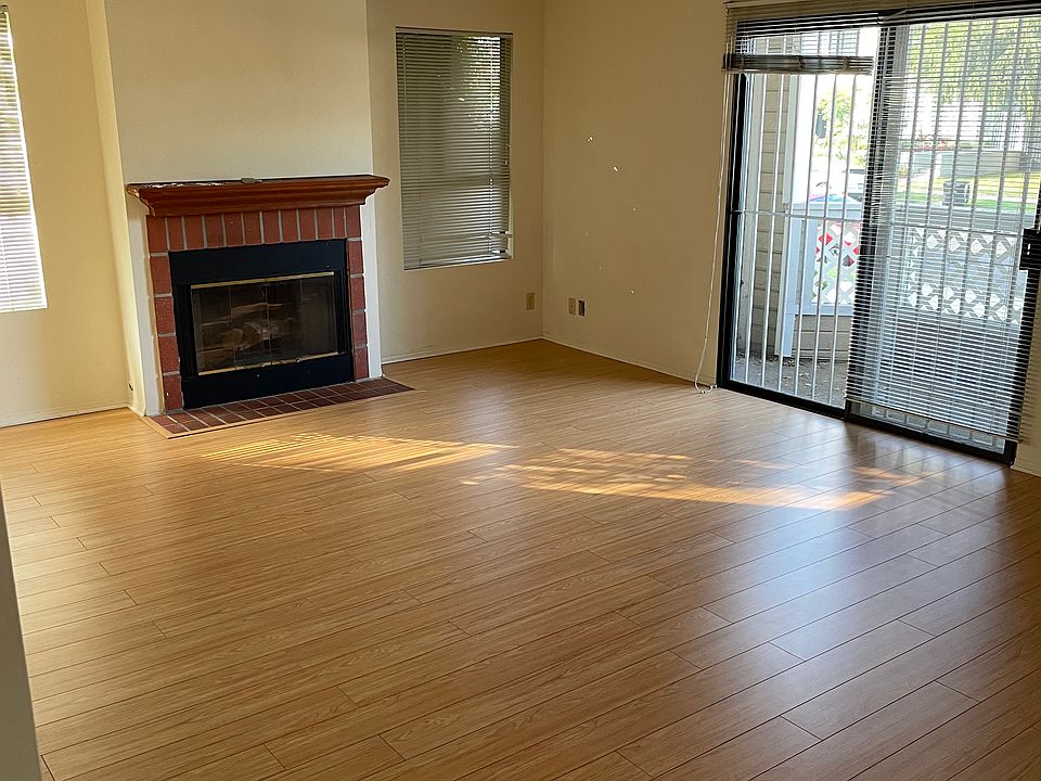 Living Room with fireplace and balcony