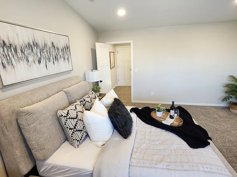 Extra large primary bedroom. (Pictures are of another unit with similar finishes and features.)