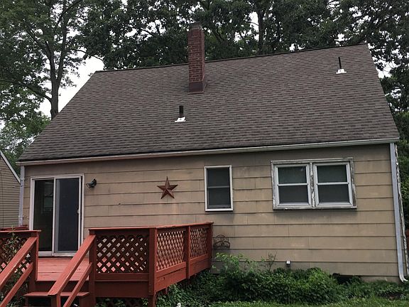 Back of house with deck