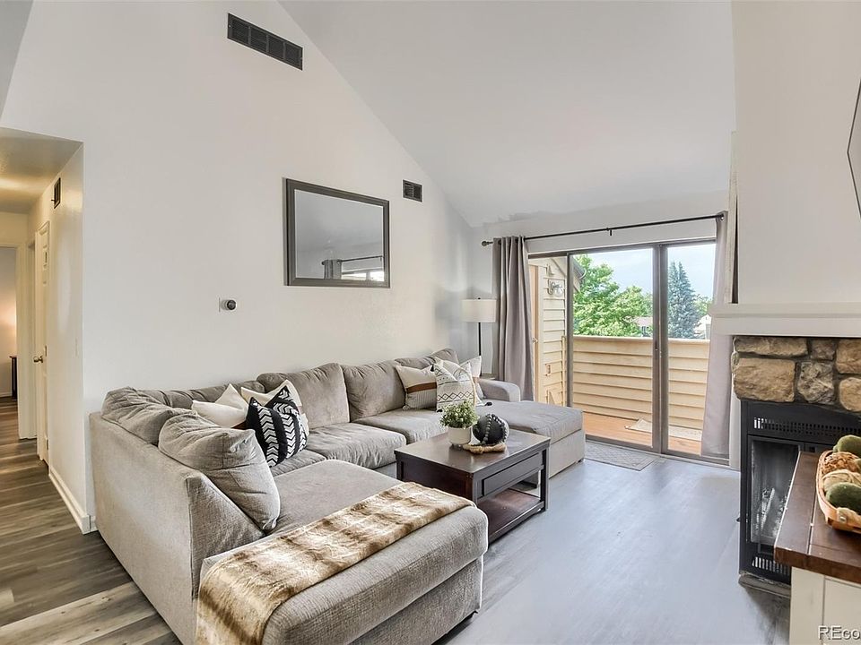 Front room with vaulted ceiling & patio access