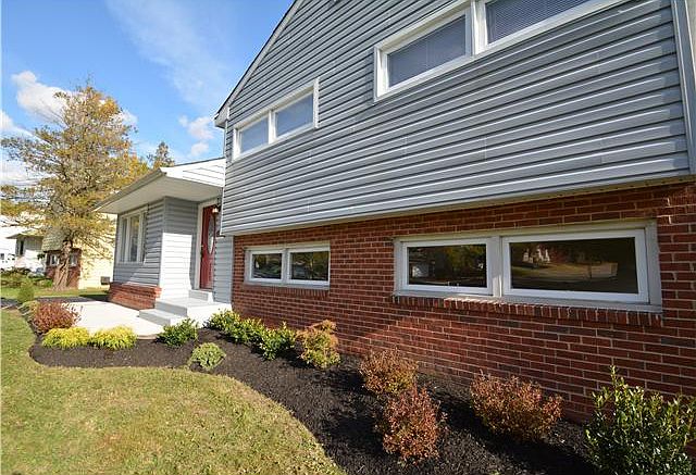 Fresh landscaping and new concrete walkway