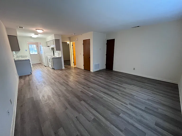1-bed front door/living room