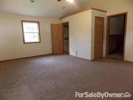 Family Room - New Carpet
						:
						Vaulted ceiling w/ half bath & closet. Enter through garage or front of house.