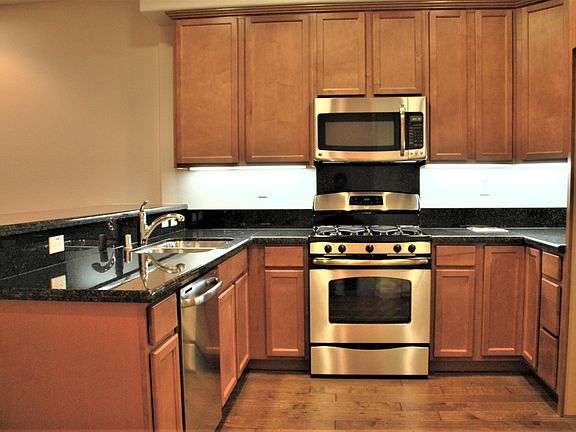 Kitchen includes Dishwasher, Refrigerator, Gas Range, Oven, Microwave