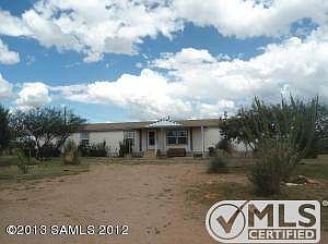 Front of home with circle drive to right