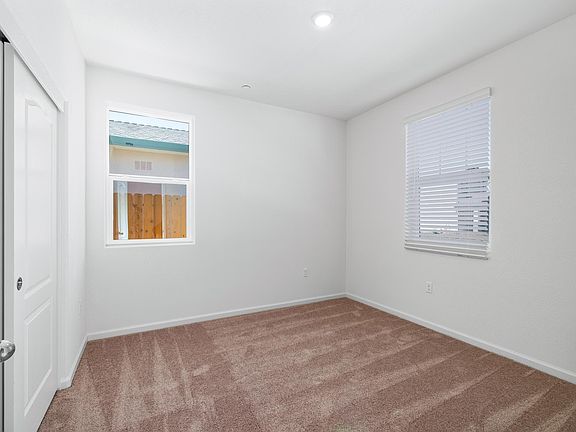 The secondary bedrooms are big enough to fit a large bed between two nightstands!