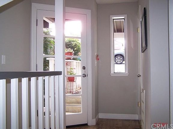 Entry, with stairs at left and laundry & powder room to right.