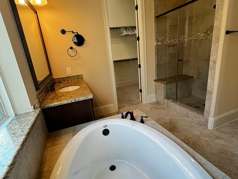 Master Bathroom with Tub, Shower and Two Walk-in Closets