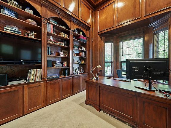 The judges paneling gives a sophisticated feel to this study, which is conveniently located in the front of the house.