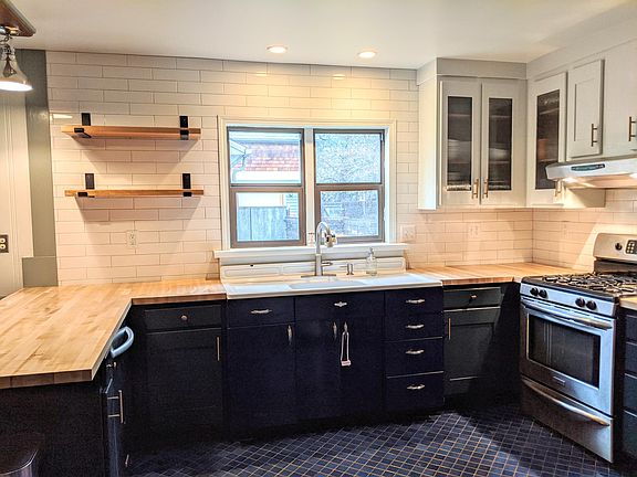 Remodeled kitchen in 2020, butcher block counters, vintage sink, Kitchen Aide gas range (not pictured)