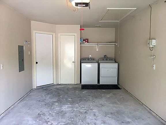 One-car garage. Mid-tier washer and dryer. Attic access and electrical box.