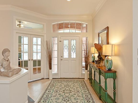Inviting large foyer with high ceilings and abundant natural light.