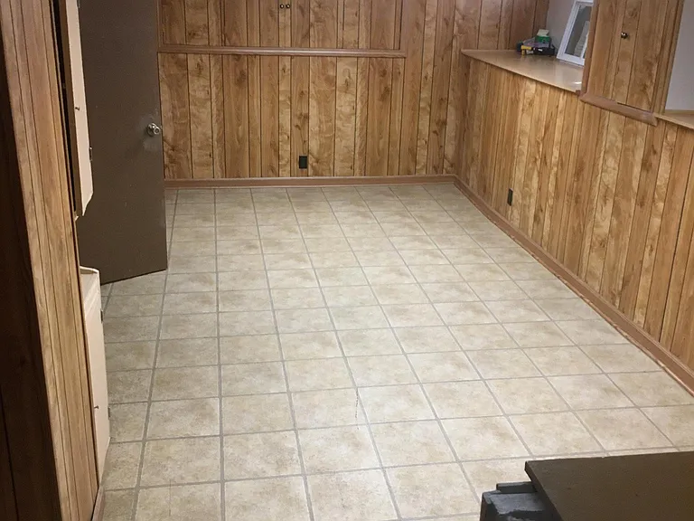Finished basement. Open area and large laundry/storage room.