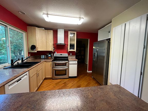 Kitchen looking south. Trash compactor 4 gal capacity. Frigidaire refrigerator.
