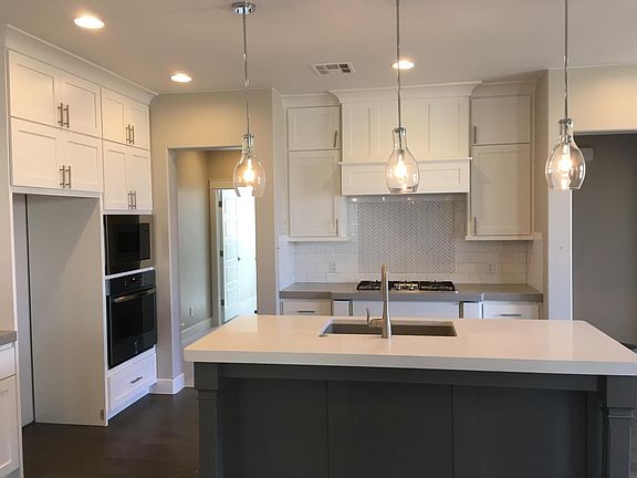 kitchen with mudroom, garage, pantry, 1/2 bath and laundry t