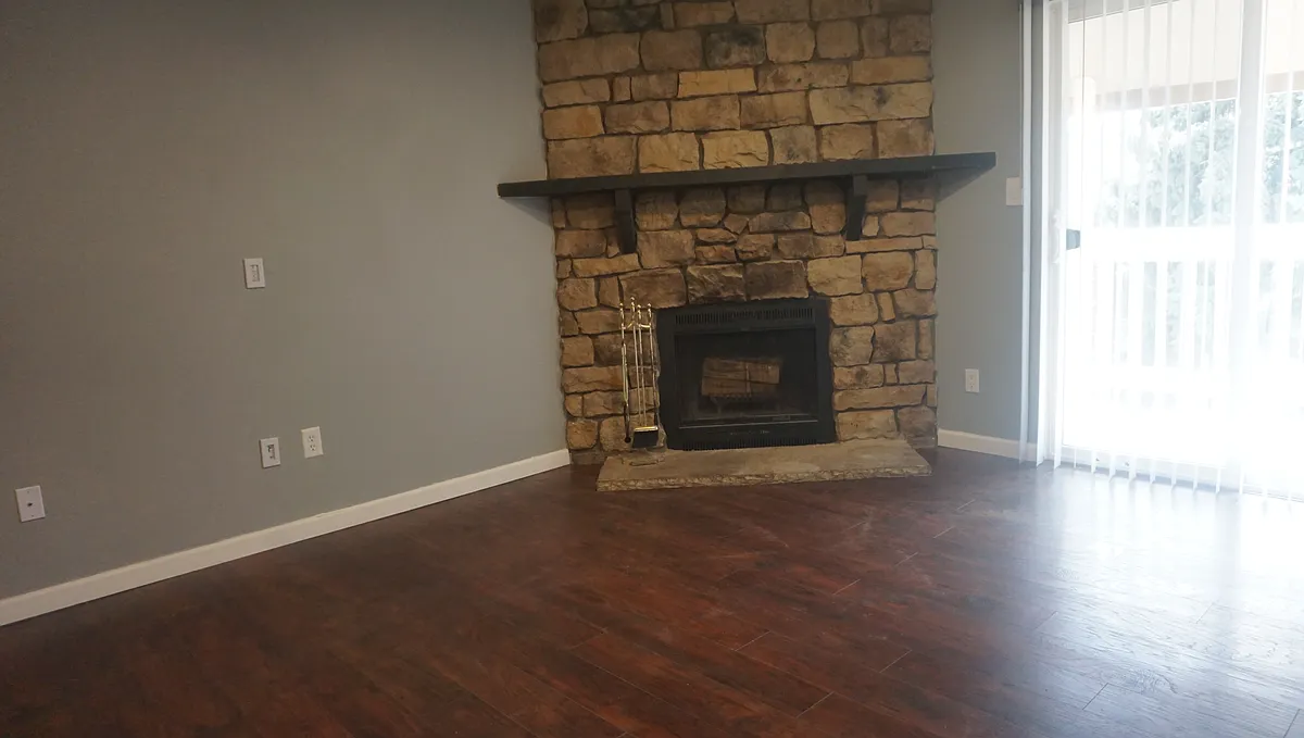 Cozy fireplace with adjacent patio. - 4400 S Quebec St #B208