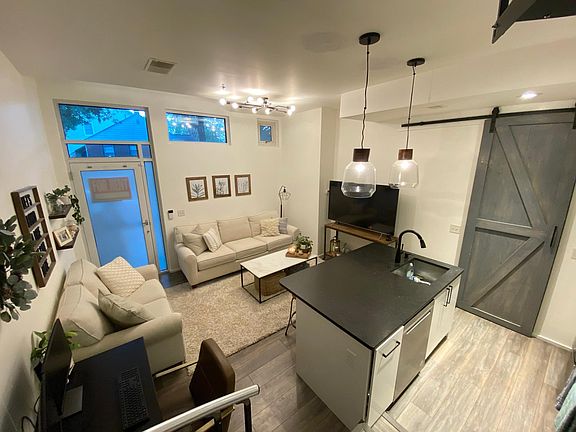 Living room and kitchen island from the stairs