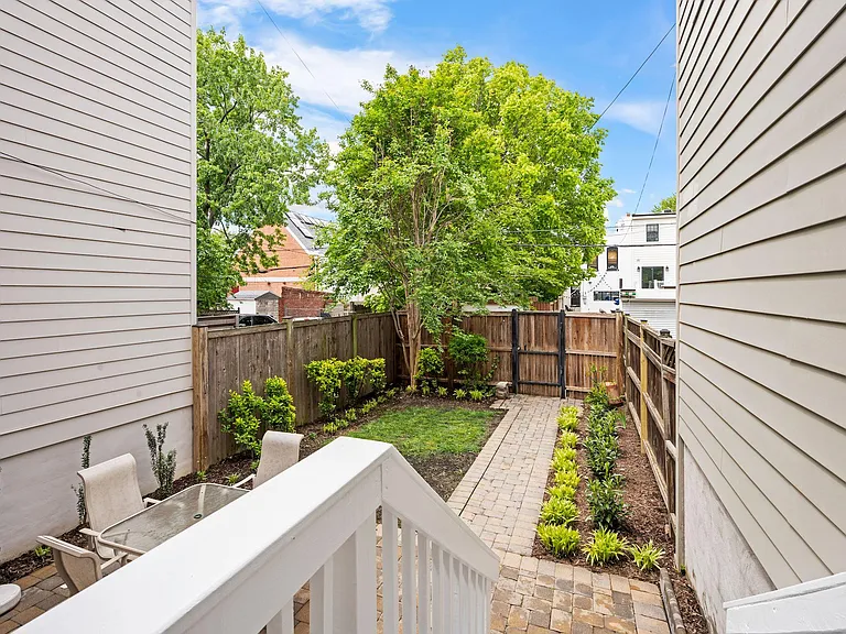 Large backyard with green space and patio