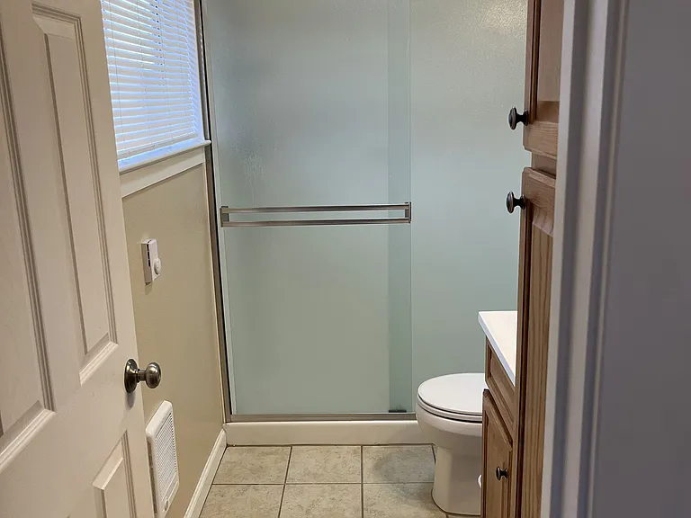 Walk-in shower off bedroom