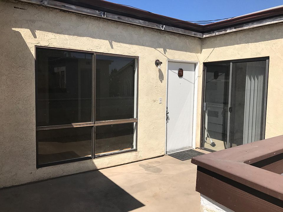 front door with spacious deck