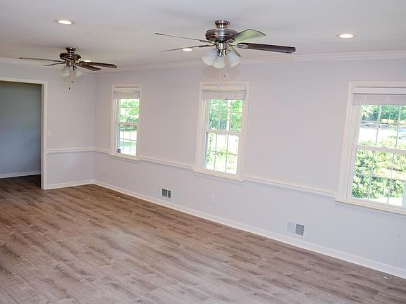 Living room. New flooring through out the house, scraped off popcorn ceiling, crown molding and much more. All work has been done with care and attention to details.