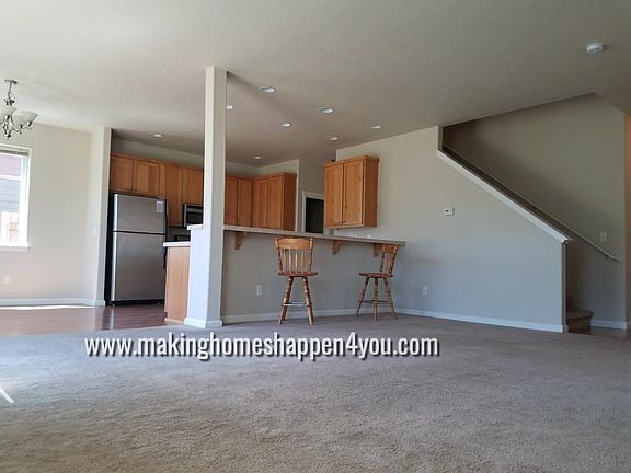 Back side of home Across living space towards kitchen
