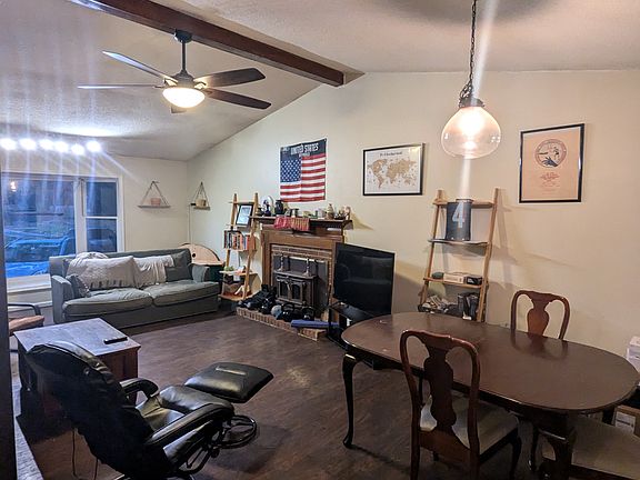 Shared Living room with bay window and vaulted ceiling.