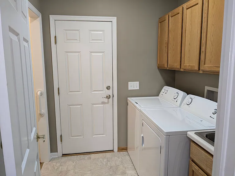 Laundry room off garage includes washer and dryer