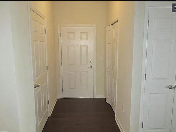 Entry way. In unit washer/dryer on the left