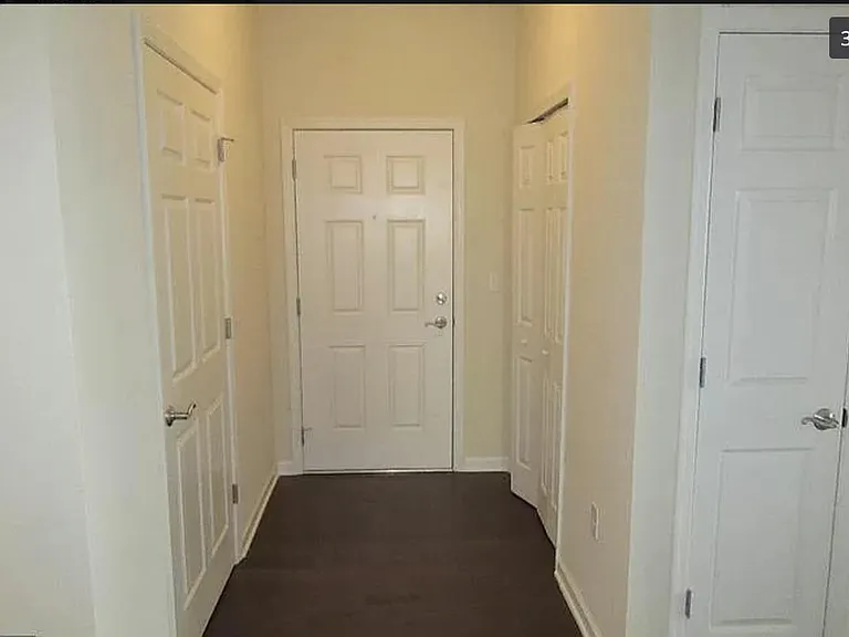 Entry way. In unit washer/dryer on the left