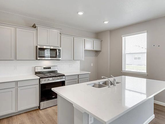 Kitchen + Pantry (the home comes with the refrigerator + dishwasher)