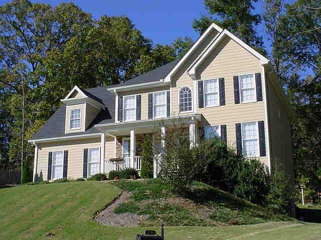 Side view of beautifully manicured lot.