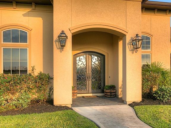 Beautiful front double entry is adorned with custom iron ! 4 HVAC units keep this home very energy efficient with the average monthly electric approx $240 mo! There are 2 Tankless water heaters to ensure plenty of instant on demand water!